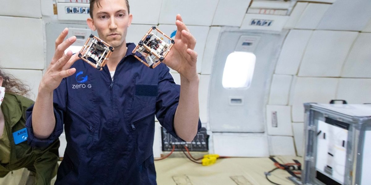MIT PhD student Martin Nisser tests self-reconfiguring robot blocks, or ElectroVoxels, in microgravity. Photo: Steve Boxall/ZeroG