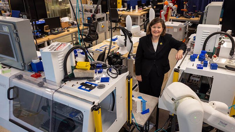 Dawn Tilbury in the SMART 4.0 Lab in the Ford Robotics Building at U-M. This equipment will help test digital twin software developed through the new center. Credit: Marcin Szczepanski/Michigan Engineering