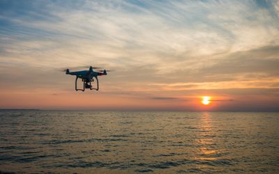 Monitoring maritime emissions at land and sea using drones and handheld particle sensors