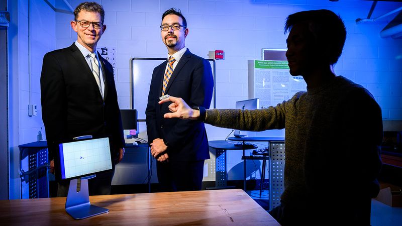 Illinois professors Richard Sowers, left, and Manuel Hernandez used machine learning techniques to improve data analysis from wearable sensors to detect symptoms and monitor the progression of Parkinson’s disease. Photo by Fred Zwicky