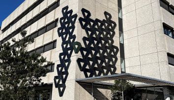 Creative ivy-shaped solar panel system against facade on the High Tech Campus Eindhoven