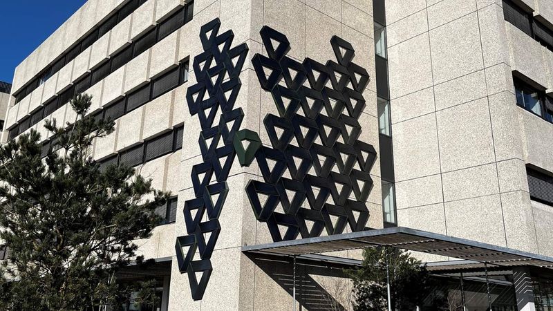 Creative ivy-shaped solar panel system against facade on the High Tech Campus Eindhoven