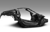 Implementing carbon fiber composites in structural automotive components for reducing CO2