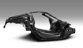 Implementing carbon fiber composites in structural automotive components for reducing CO2