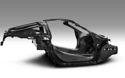 Implementing carbon fiber composites in structural automotive components for reducing CO2