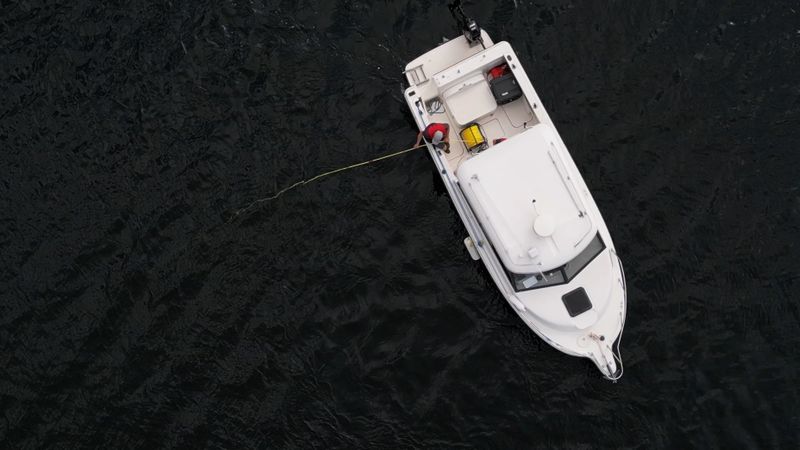 small boat deploying an ROV for marine research.