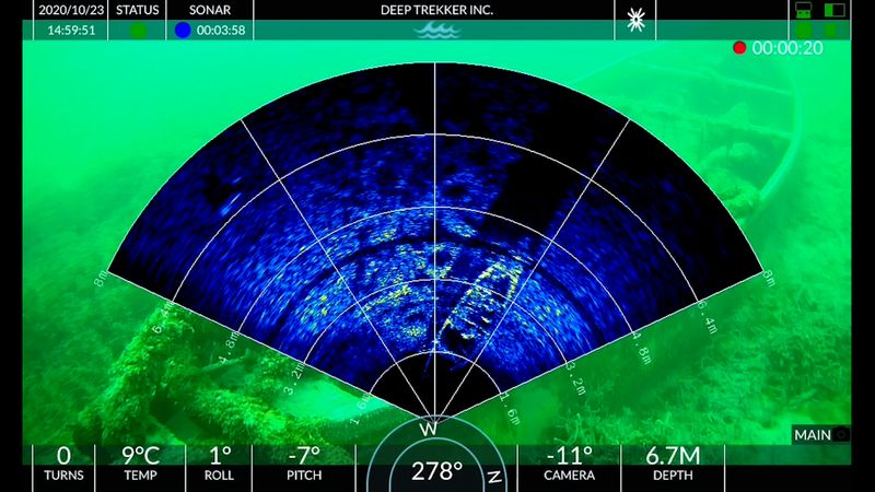 Sonar scan overlay with camera image in background.