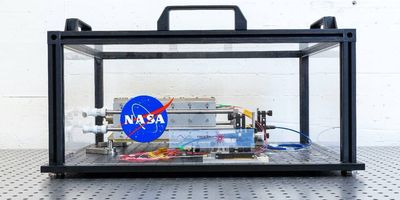 The first prototype of a laser sits on a testbed at the Swiss Center for Electronics and Microtechnology (CSEM), headquartered in Neuchâtel, Switzerland. CSEM will test and characterize the laser, which will be used to conduct gravitational wave experiments in space for the LISA mission. Credits: European Space Agency/CSEM