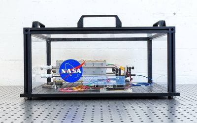 Constructing the first lunar base with space-ready 3D concrete printers