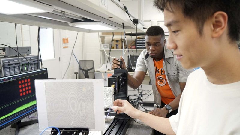 The researchers used a specially designed metasurface to direct the transmissions. Photos by Aaron Nathans/Princeton University.