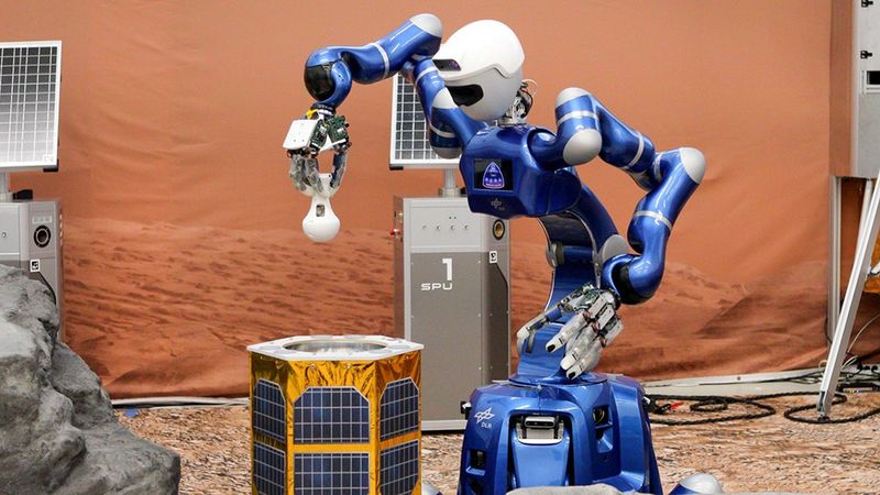 The Surface Avatar team demonstrated the handover of tasks between multiple robots: after ESA's Spot robot filled the transfer station with rock samples, NASA astronaut Jonny Kim commanded DLR's Rollin' Justin robot to move the containers from the transfer station to the lander. Credit: DLR (CC BY-NC-ND 3.0)