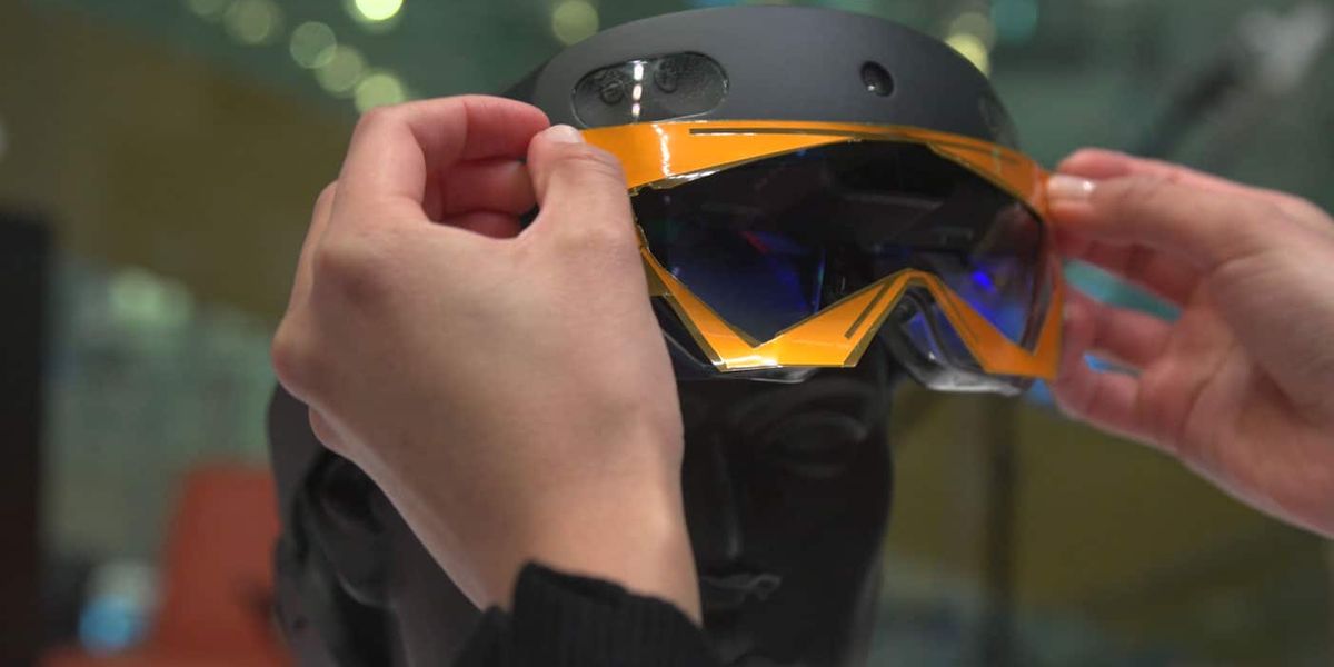An augmented reality headset combines computer vision and wireless perception to automatically locate a specific item that is hidden from view, perhaps inside a box or under a pile, and then guide the user to retrieve it. Image: Courtesy of the researchers, edited by MIT News