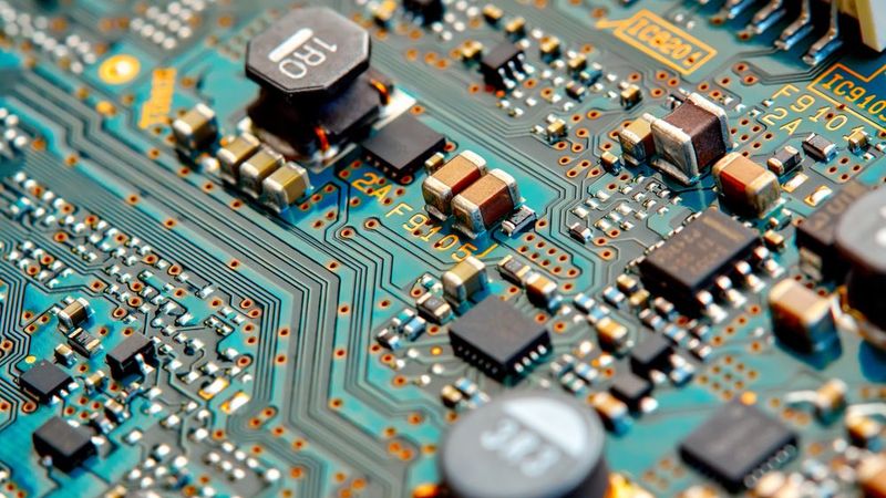 A circuit board showing its traces, vias, electronic components, solder mask and more.