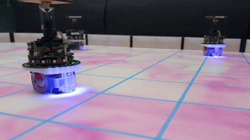 A swarm of e-puck robots equipped with UV-pheromone-module and omni-directional camera to release artificial es pheromone [Image Credit: Research Paper]