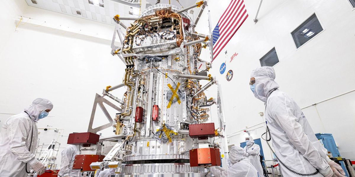 NASA's Europa Clipper spacecraft is visible in a main clean room at JPL, as engineers and technicians inspect it just after delivery in early June 2022. Credit: NASA/JPL-Caltech/Johns Hopkins APL/Ed Whitman