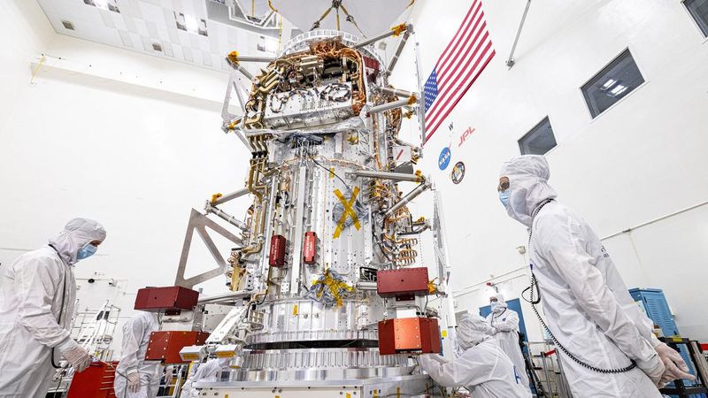 NASA's Europa Clipper spacecraft is visible in a main clean room at JPL, as engineers and technicians inspect it just after delivery in early June 2022. Credit: NASA/JPL-Caltech/Johns Hopkins APL/Ed Whitman