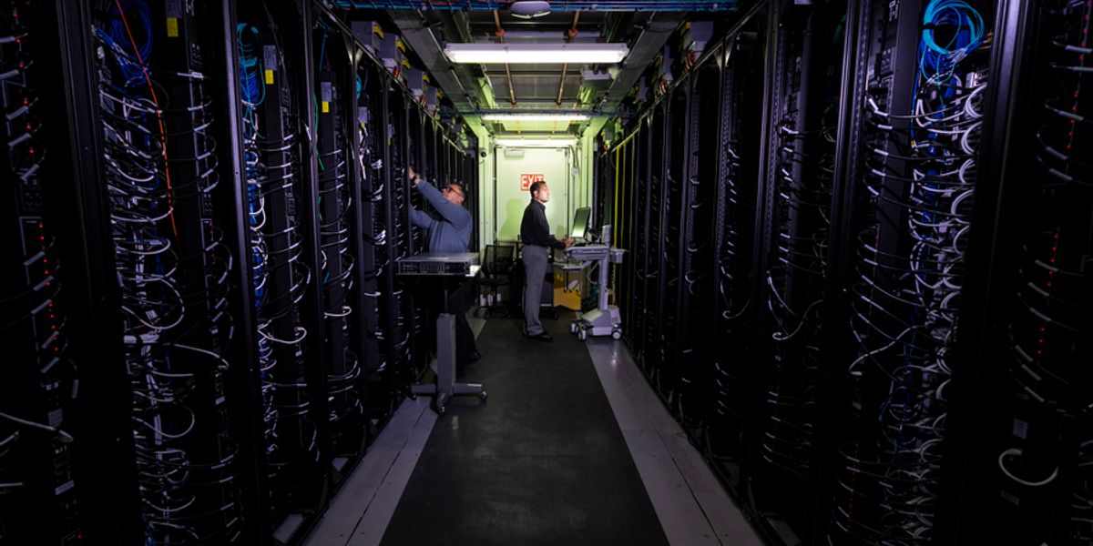 At the Lincoln Laboratory Supercomputing Center, researchers are making changes to cut down on energy use. One of their techniques can reduce the energy of training AI models by 80 percent. Photo: Glen Cooper