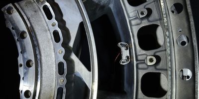 HAMR-E uses electroadhesive pads on its feet and a special gait pattern to climb on vertical, inverted, and curved surfaces, like the inside of this jet engine. Credit: Wyss Institute at Harvard University