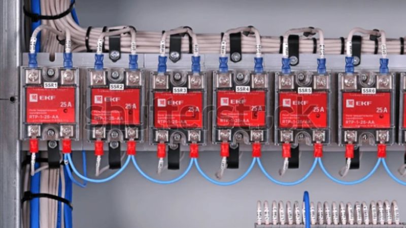 An array of single-phase solid state relays mounted on an industrial control panel