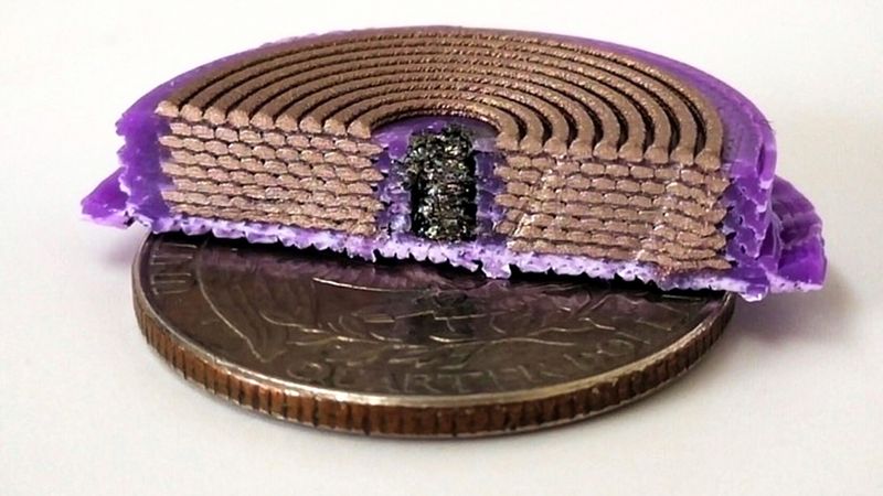 MIT researchers modified a multi-material 3D printer so it could produce three-dimensional solenoids in one step by layering ultrathin coils of three different materials. It prints a U.S. quarter-sized solenoid as a spiral by layering material around the soft magnetic core, with thicker conductive layers separated by thin insulating layers. Image: Courtesy of the researchers