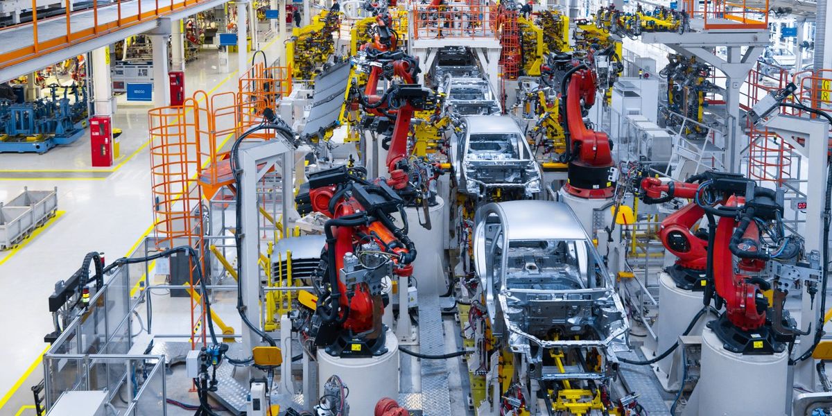 Assembly line production of new car. Automated welding of car body on production line. robotic arm on car production line is working