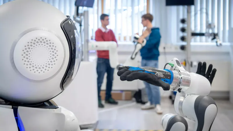 Care robot GARMI (front left) in the research laboratory at the Technical University of Munich (TUM) in Garmisch-Partenkirchen is becoming increasingly adept.