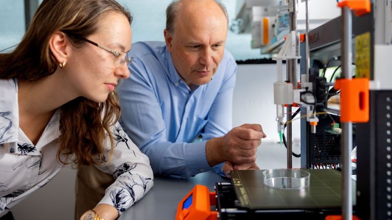 Lawrence Bonassar, the Daljit S. and Elaine Sarkaria Professor in Biomedical Engineering and in Mechanical and Aerospace Engineering, and doctoral student Alicia Matavosian examine a smart sensor developed with Jared Matthews ’21.