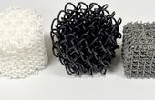 Reimagining Chain Mail: 3D Architected Materials That Adapt and Protect