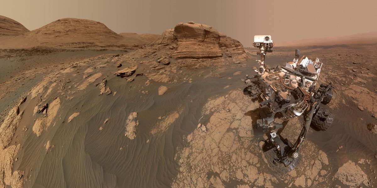 NASA’s Curiosity Mars rover used two cameras to create this selfie in front of Mont Mercou, a rock outcrop that stands 20 feet (6 meters) tall. The panorama is made up of 60 images from the MAHLI camera on the rover’s robotic arm along with 11 images from the Mastcam on the mast, or “head,” of the rover.   Credit: NASA/JPL-Caltech/MSSS