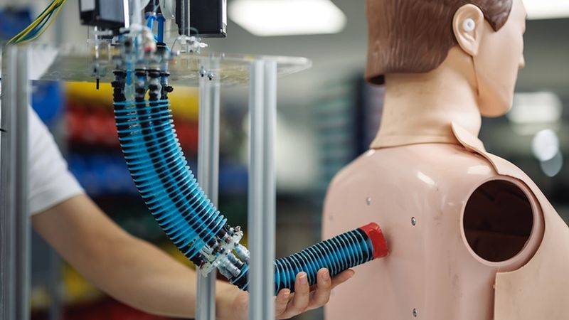 A new soft robotic arm can safely operate close to the human body without causing discomfort or injury. The AI control system is well-suited for assistive scenarios like showering, where the arm can help wipe the back — supporting people with limited mobility and easing the load on caregivers. Photo courtesy of the National University of Singapore.