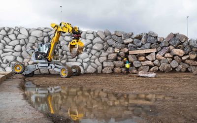 Autonomous excavator constructs a six-metre-high dry-stone wall