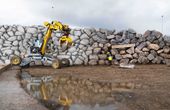 Autonomous excavator constructs a six-metre-high dry-stone wall