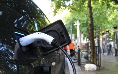 Electric Vehicle Charging Station from Public Electricity and Solar Panels