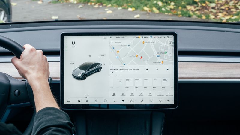 Dashboard of a Tesla Model 3, a fully electric vehicle with autopilot features