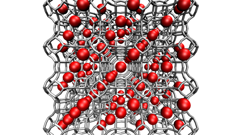 A conceptual illustration of a porous crystalline material. The red spheres represent voids where CO2 might collect. Credit: NIST