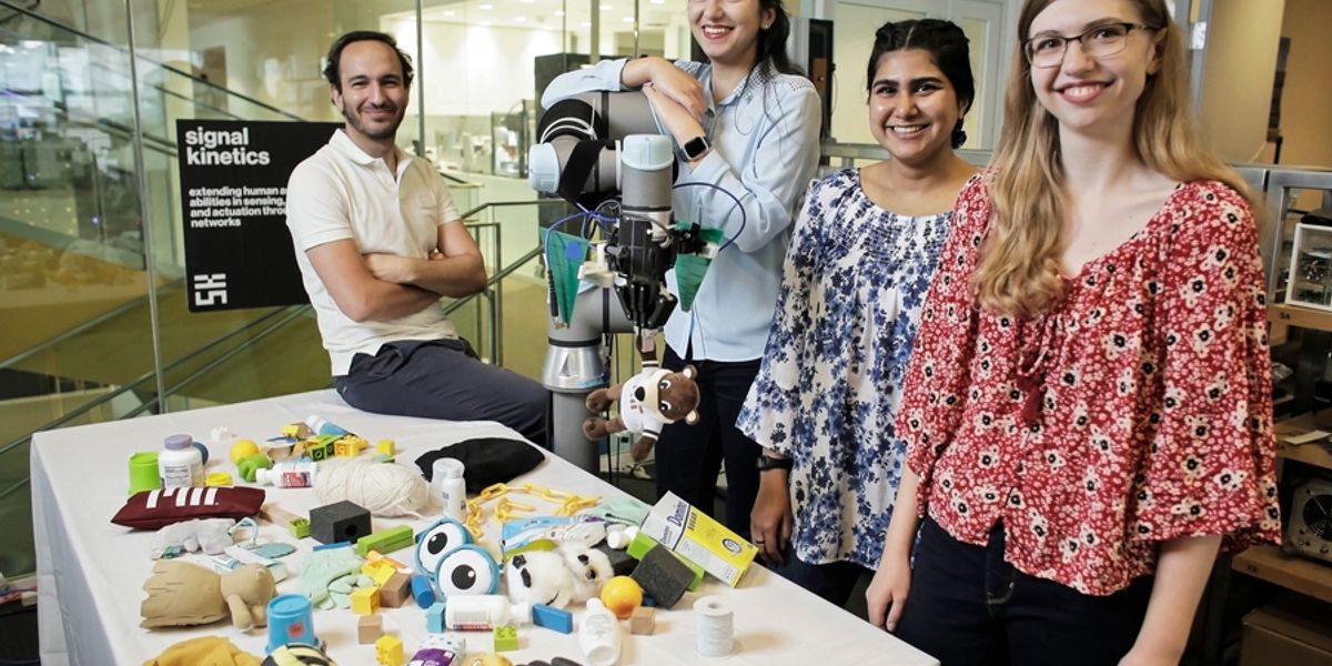 Fadel Adib, associate professor in the Department of Electrical Engineering and Computer Science and director of the Signal Kinetics group in the MIT Media Lab (far left) with (from left to right) Tara Boroushaki, Nazish Naeem, and Laura Dodds, research assistants in the Signal Kinetics group. Image: James Day, MIT Media Lab