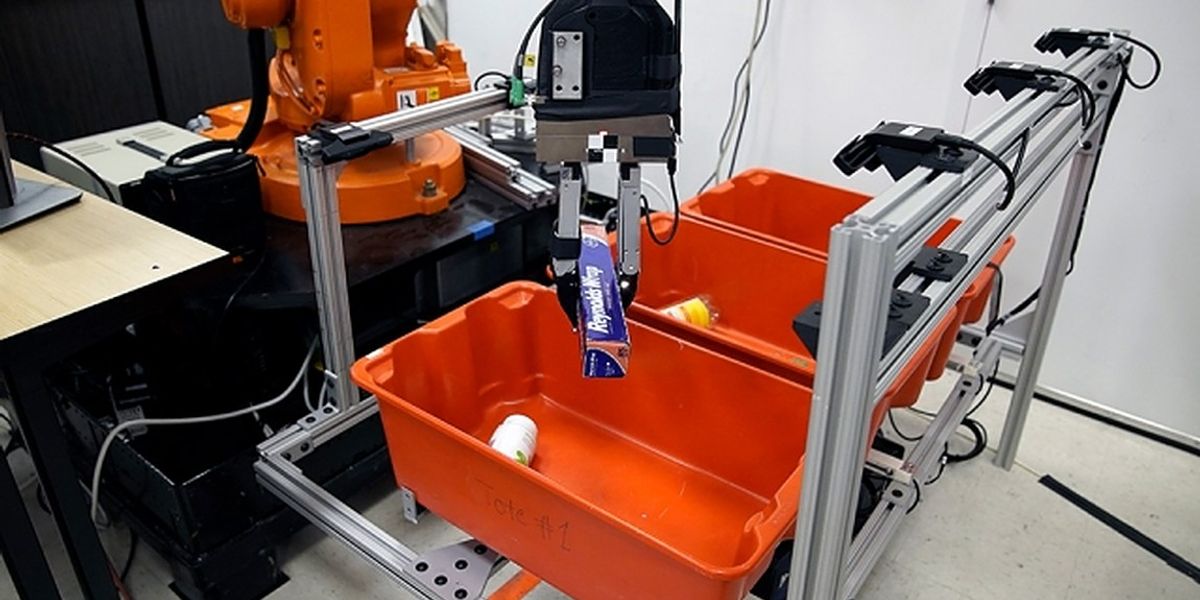 The “pick-and-place” system consists of a standard industrial robotic arm that the researchers outfitted with a custom gripper and suction cup. They developed an “object-agnostic” grasping algorithm that enables the robot to assess a bin of random objects and determine the best way to grip or suction onto an item amid the clutter, without having to know anything about the object before picking it up.