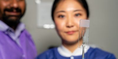 Dr. Abhishek Jain, Jennifer Lee and the vessel-chip. | Image: Texas A&M Engineering
