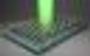A green laser shines onto an atomically thin material. By probing how atoms vibrate when deposited on substrates and upon heating, researchers turn Raman spectroscopy into a scientific “ruler” to understand how 2D materials expand. Courtesy of Yang Zhong and Lenan Zhang