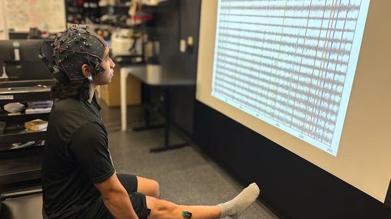 Researchers in Ismael Seáñez’s lab have developed a type of decoder to restore communication between the brain and the area below a spinal cord injury. Through experiments in their lab with 17 human subjects without a spinal cord injury, they were able to cue movement in the lower leg with transcutaneous spinal cord stimulation, or noninvasive, external electrical pulses. (Credit: Carolyn Atkinson)