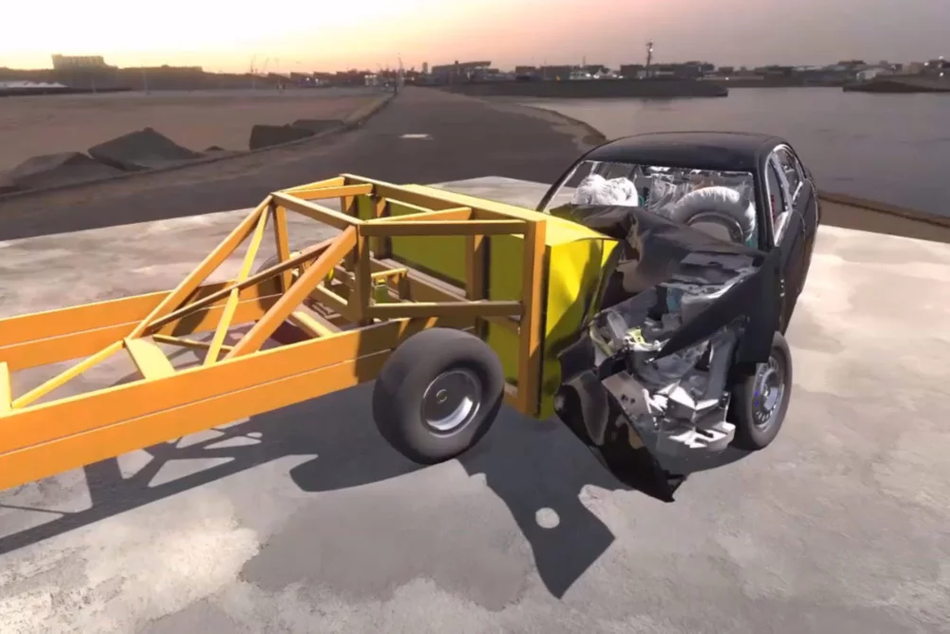 A simulation o a car impacting with truck. A yellow structure on the left of the image acs as a truck. A black car on the right side of the image has made impact with the truck and is half collapsd. Airbags are visible inside the vehicle.  
