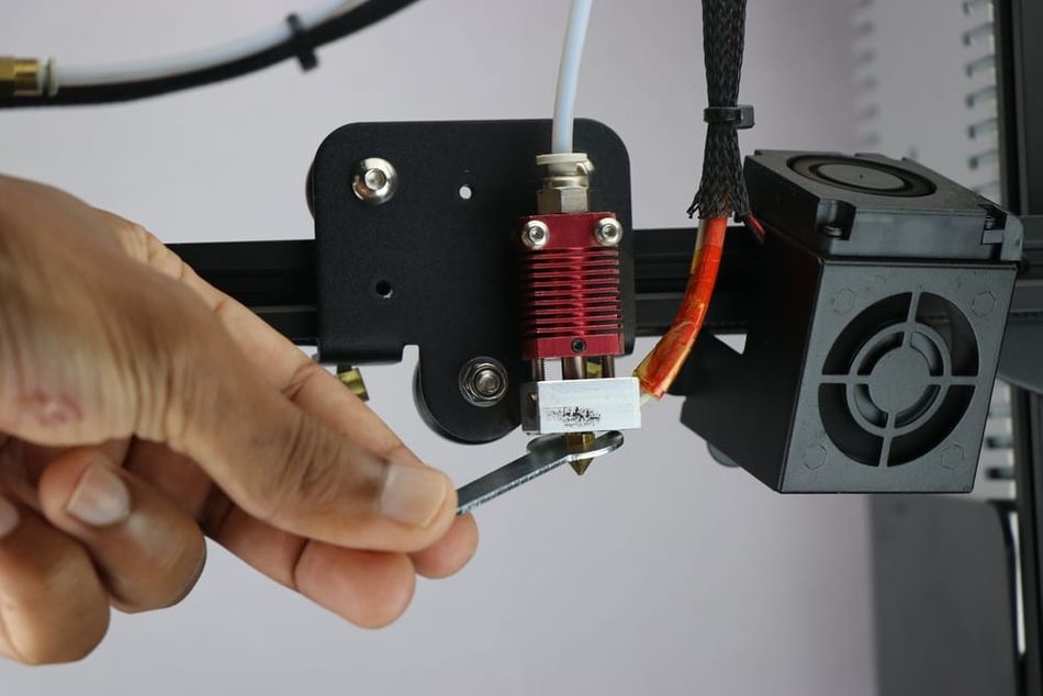 Hand and wrench with 3D printer nozzle