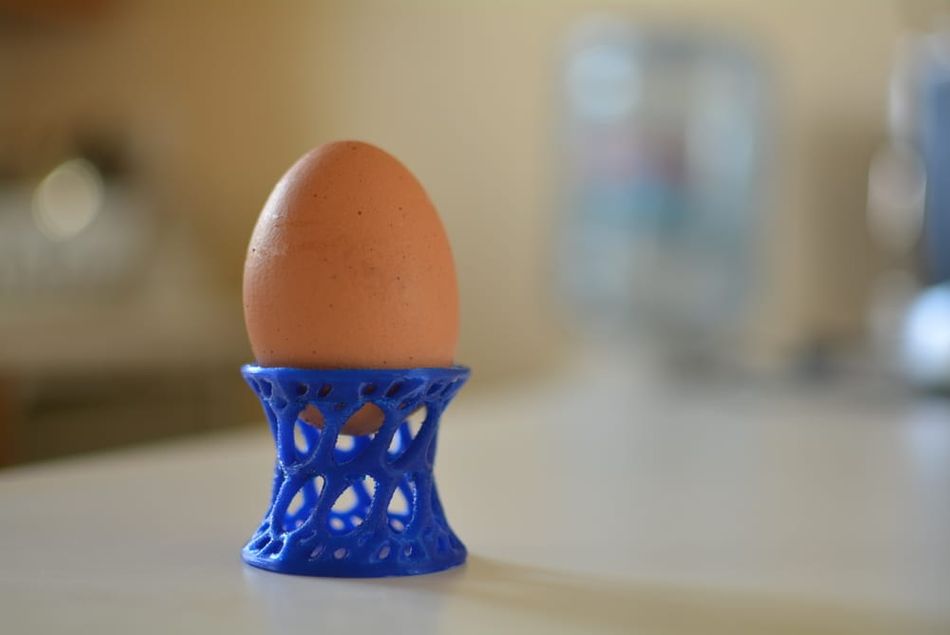 3D printed blue eggcup with egg