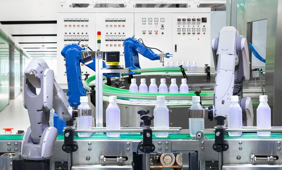 Robotic arms holding plastic bottles