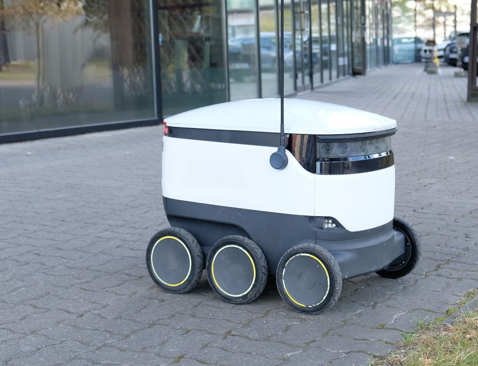 Autonomous food delivery robot on its way to deliver at doorstep. 