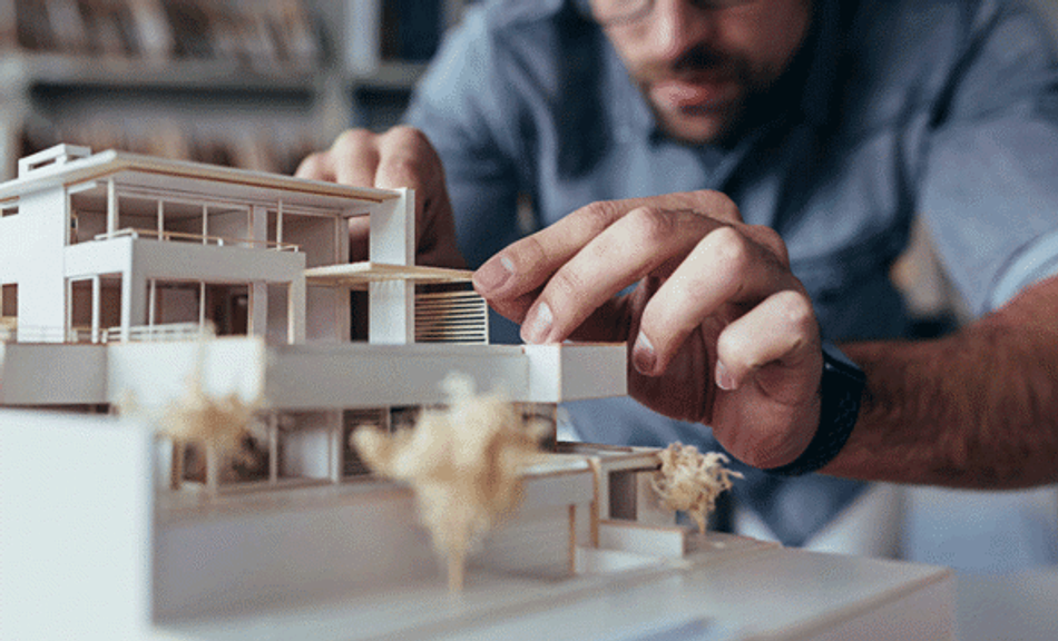 architect using a 3d printed model to test structures