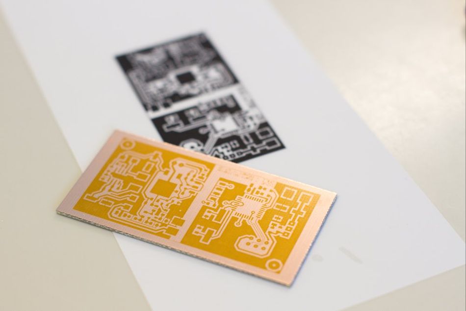 Image depicting the pre-acid stage of the circuit board etching process.