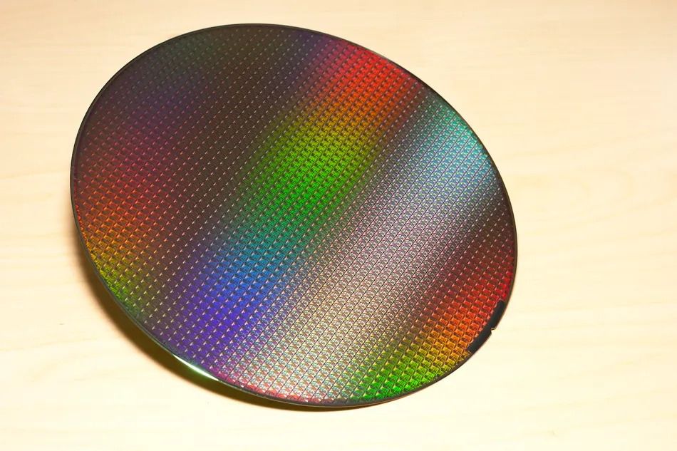 A silicon wafer containing several ASICs fabricated over it