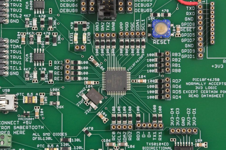 A PCB silkscreen showing component names printed in white ink