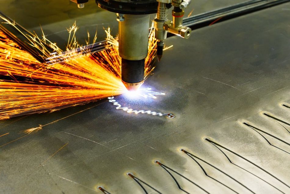 A plasma etching/cutting machine working on a metallic plate